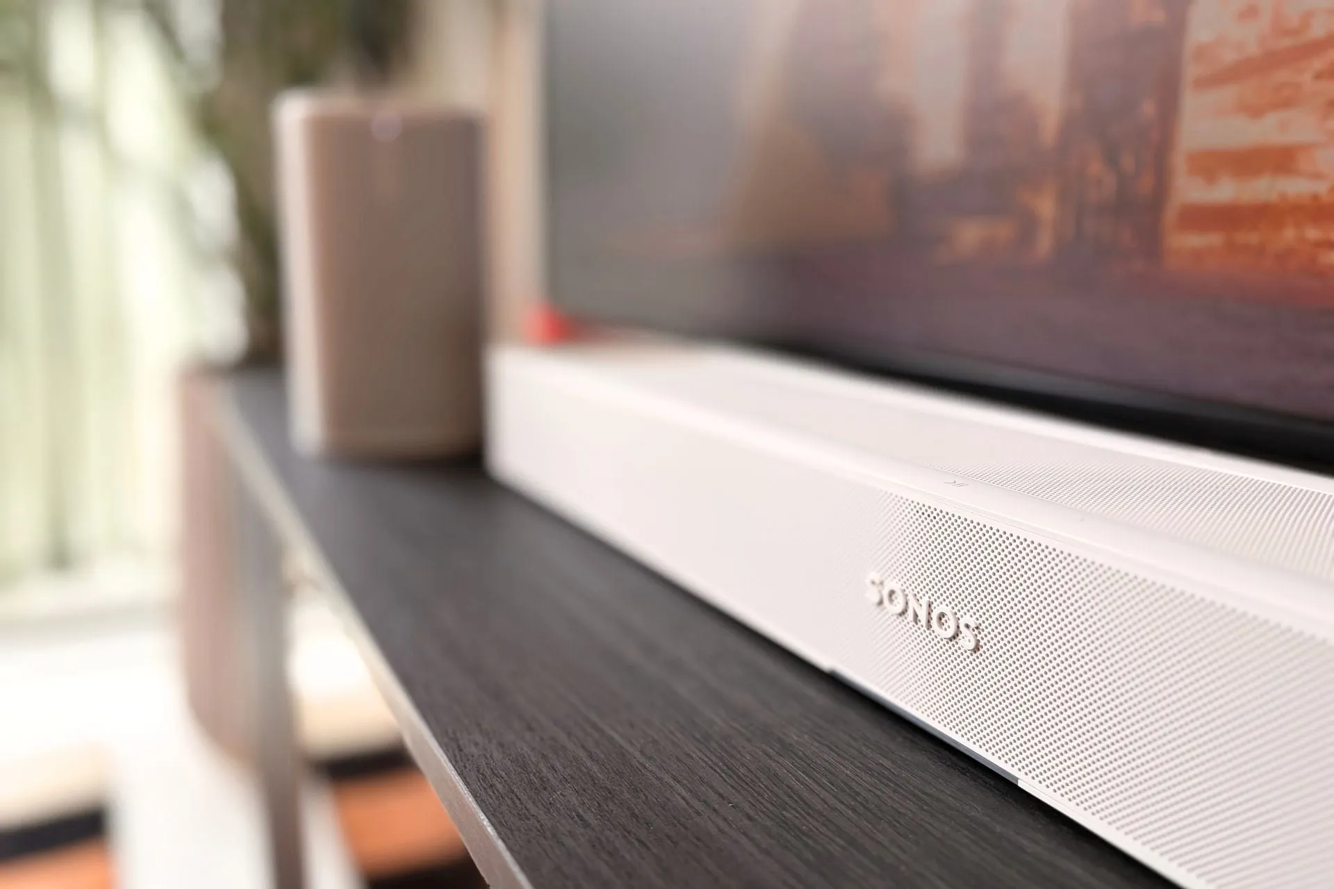 Sonos Beam Ultra in black on a TV console