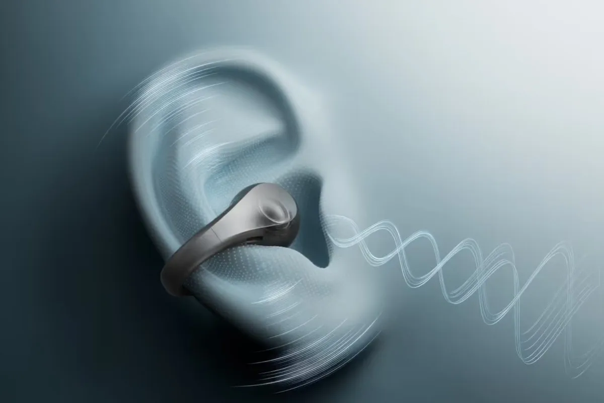 Clip-on earbud on the ear, with the sound wave projected toward the ear canal