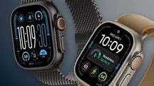 Apple Watch Ultra con correa naranja sobre fondo oscuro