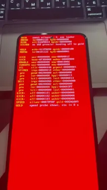 A Redmi Note 12 displays in red on black the boot log of Apple's XNU kernel