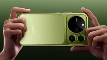 Hands holding an Honor Magic 9 Pro Max to show its rear camera module