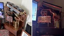 Montaje de PC abierto con tuberías de cobre y un depósito hecho con un soplete sobre una base de madera oscura