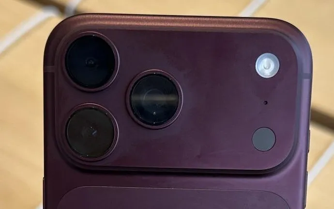 Close-up of the camera module on a Burgundy iPhone 18 Pro Max, with the area around the lenses lighter in colour