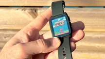 Close-up of the Pebble Time 2, a rectangular watch with an e-ink display and a metal case