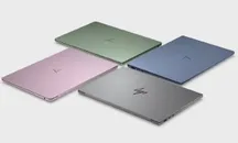 Four HP OmniBook 5 units with the lid closed, in green, blue, pink and grey