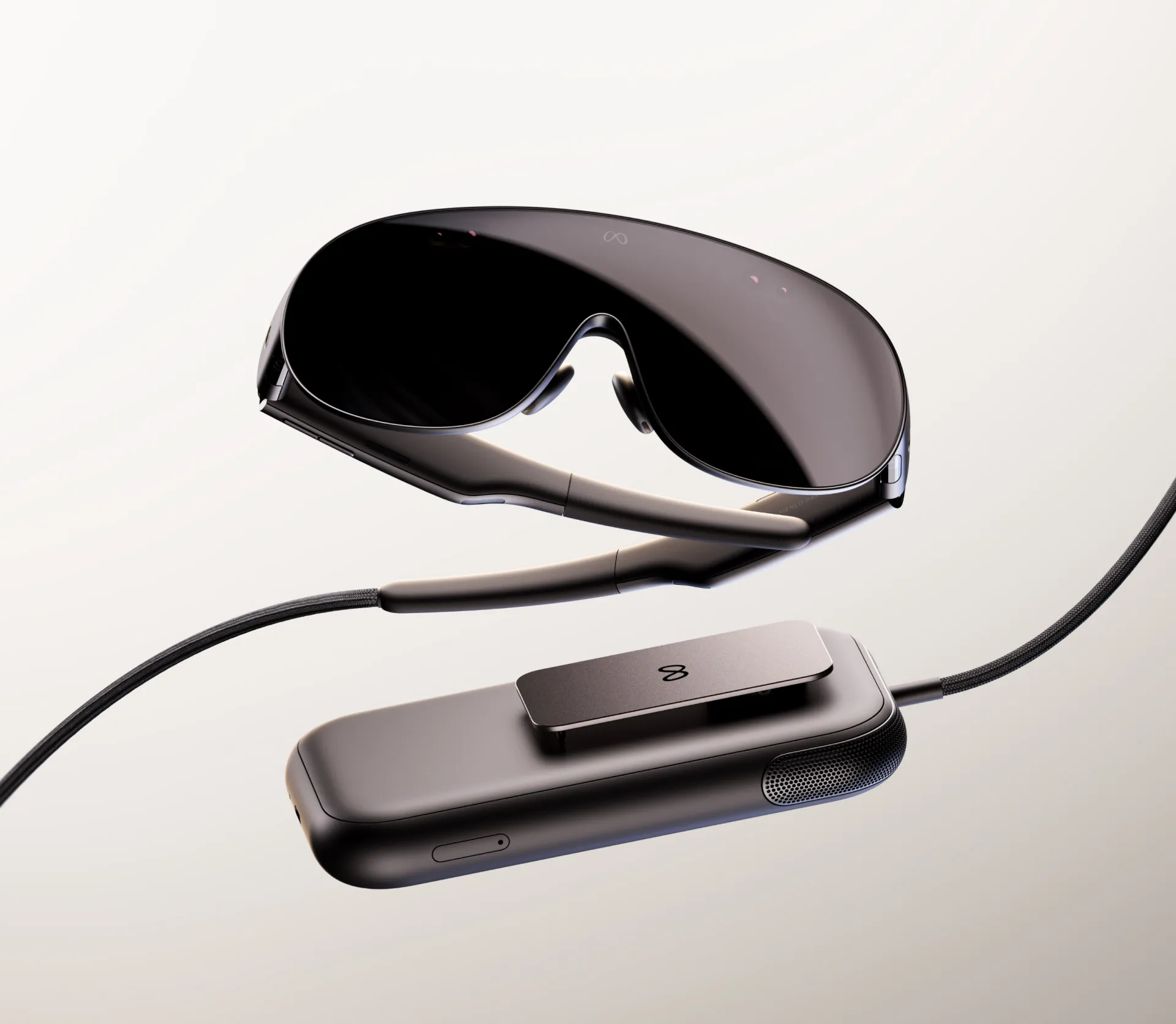 Vista de producto de las Meta VR Glasses y su puck de cómputo unidos por un cable trenzado