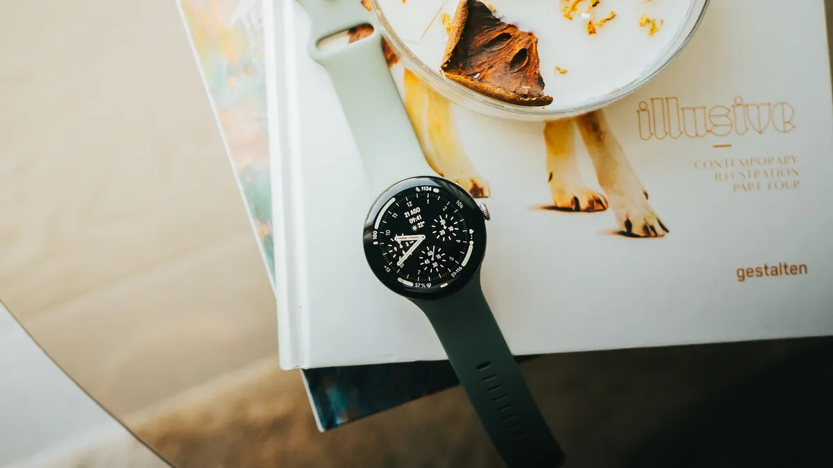 Google Pixel Watch 5 smartwatch showing a classic-style watch face
