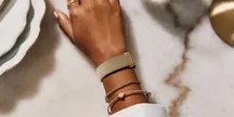 Correa Metal Mesh del Fitbit Air en plata pulida y oro champán