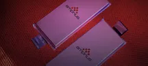 Two Amprius silicon-anode pouch cells on a red honeycomb-textured surface