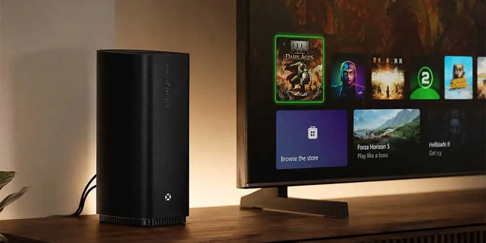 Consola Xbox Series X en vertical sobre un mueble de madera, junto a un televisor que muestra el menú principal de Xbox