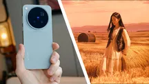 Teléfono Vivo X500 Pro Max sostenido en una mano junto a una fotografía de una modelo en un campo de heno