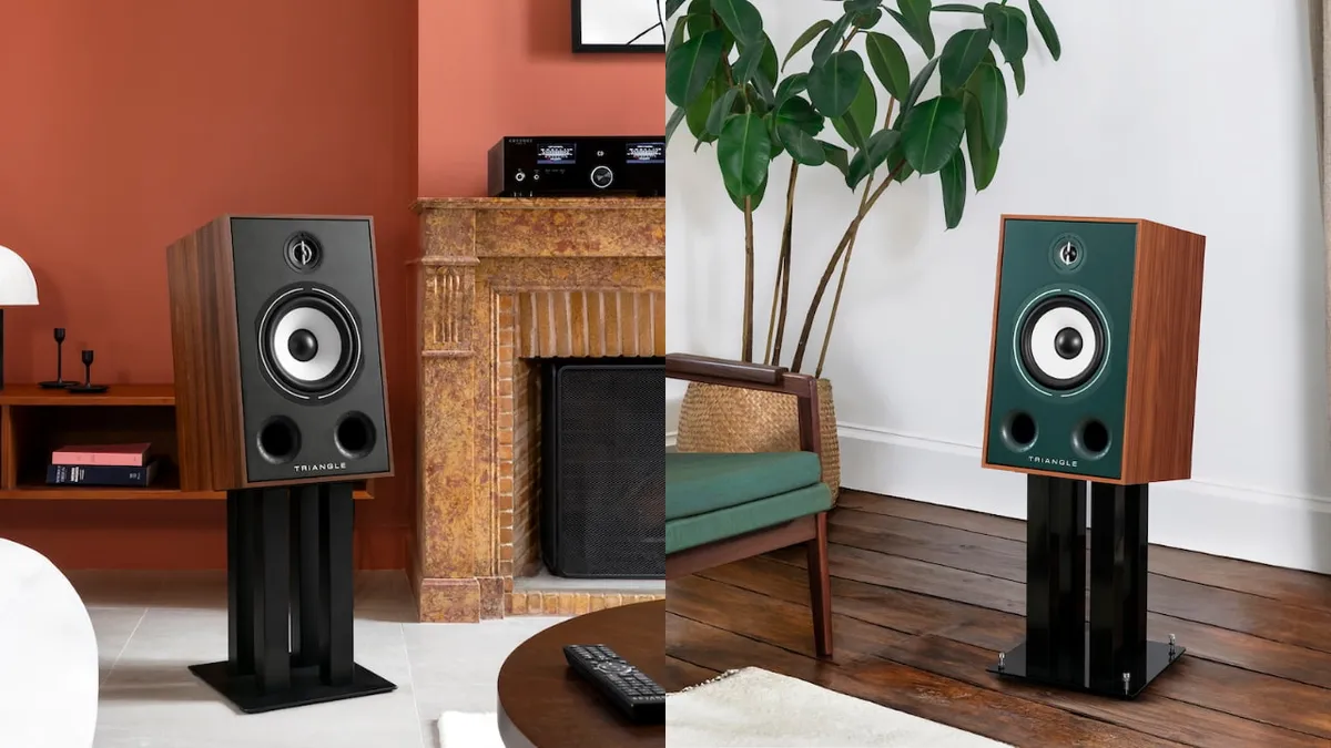 Two Triangle Borea BR05 speakers with dark and green front panels on black stands in a living room