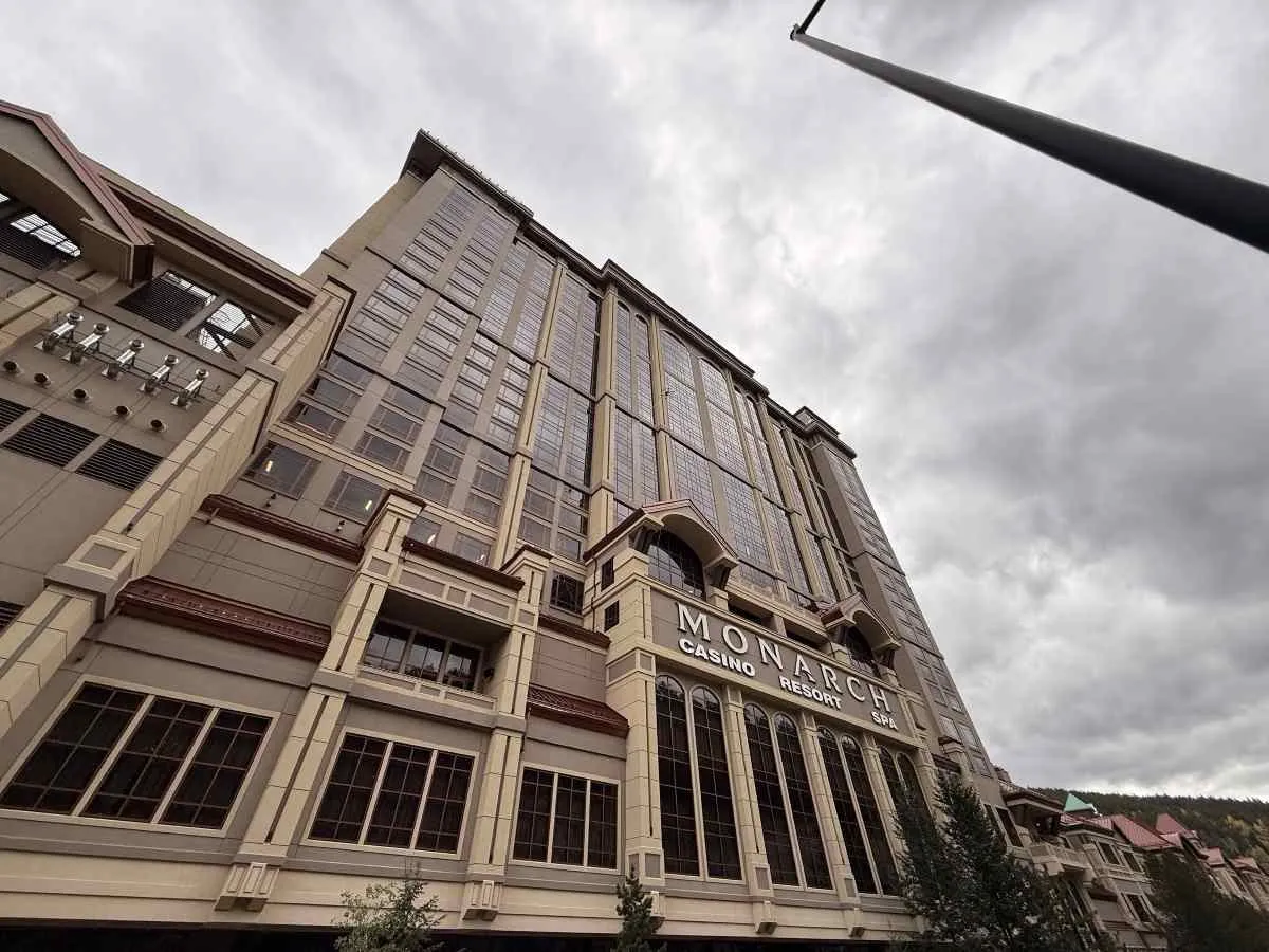 Lucid Bots Sherpa cleaning drone spraying a facade high up using the HighLine pulley system