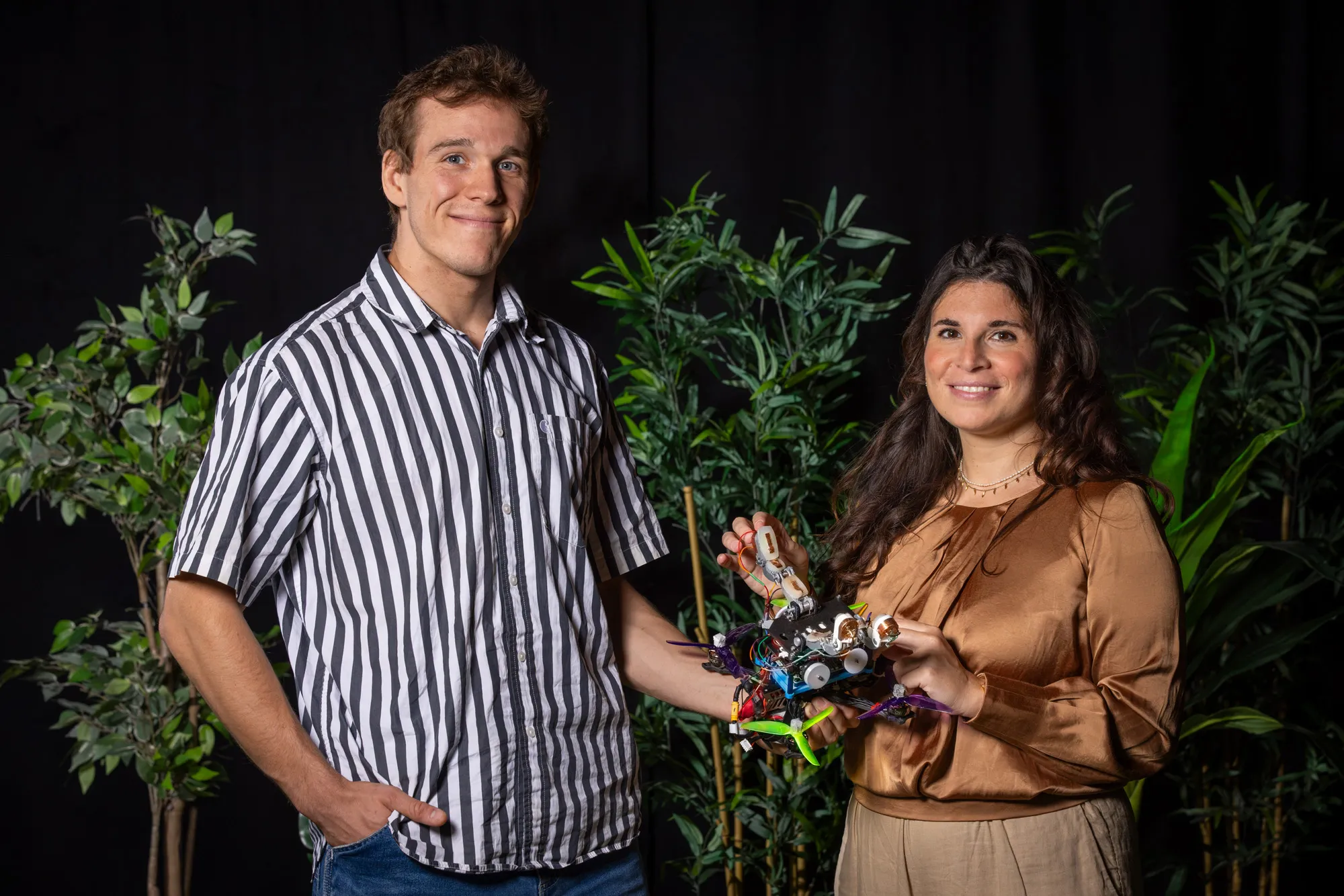 Researchers Salua Hamaza and Anton Bredenbeck, next to the drone