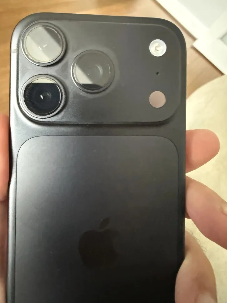 Back of a Black iPhone 18 Pro held in the hand
