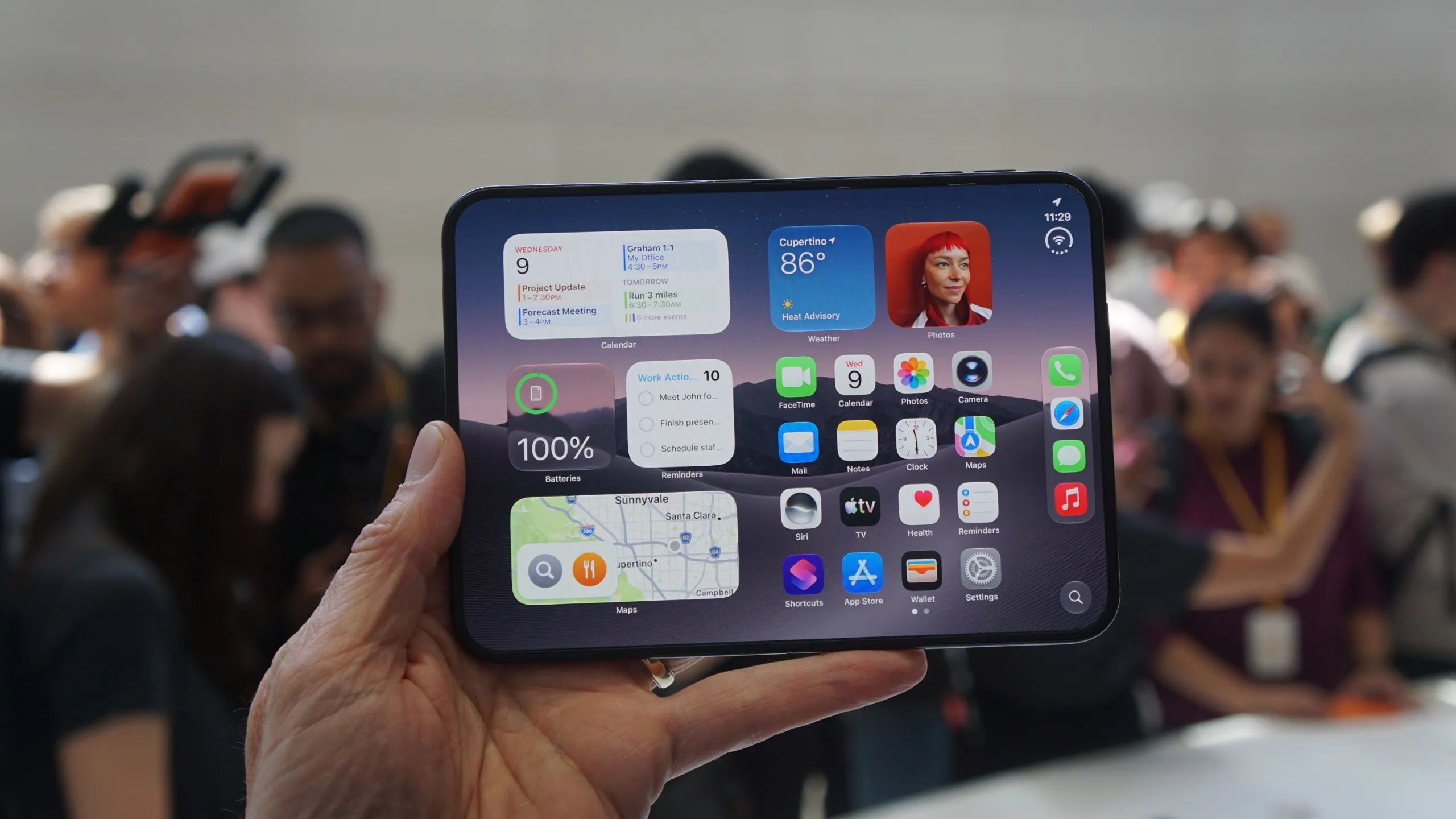 Apple’s iPhone Duo open, with the inner screen lit and widgets on the desktop
