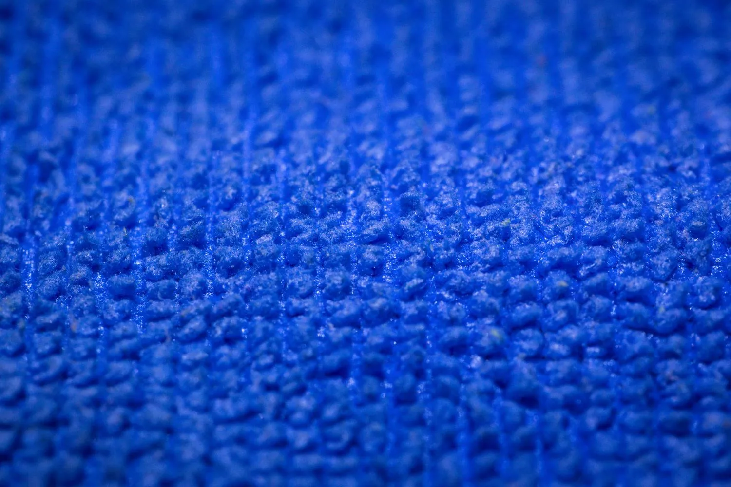 Close-up of the texture of a blue microfiber cloth