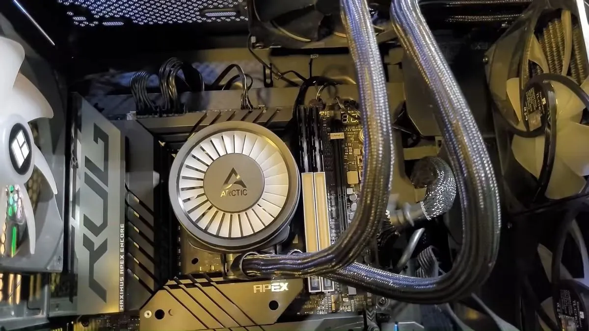 Memory modules installed beside the cooling block on an ASUS Apex motherboard