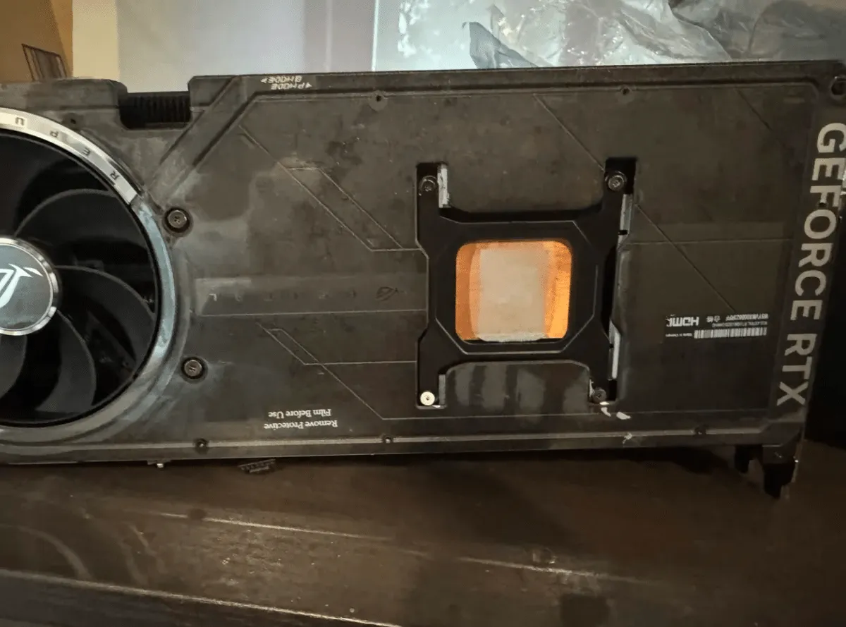 An opened graphics card found empty, with no GPU or PCB inside