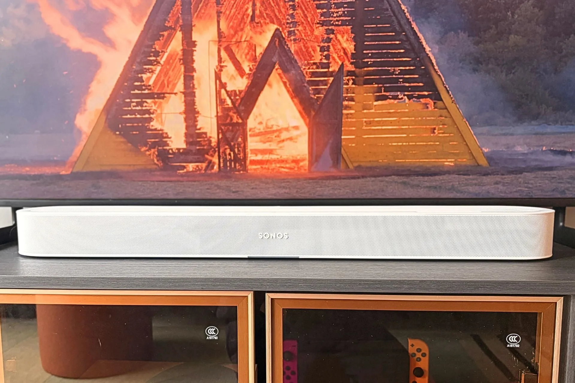 The Sonos Beam Ultra placed under a TV in a living room