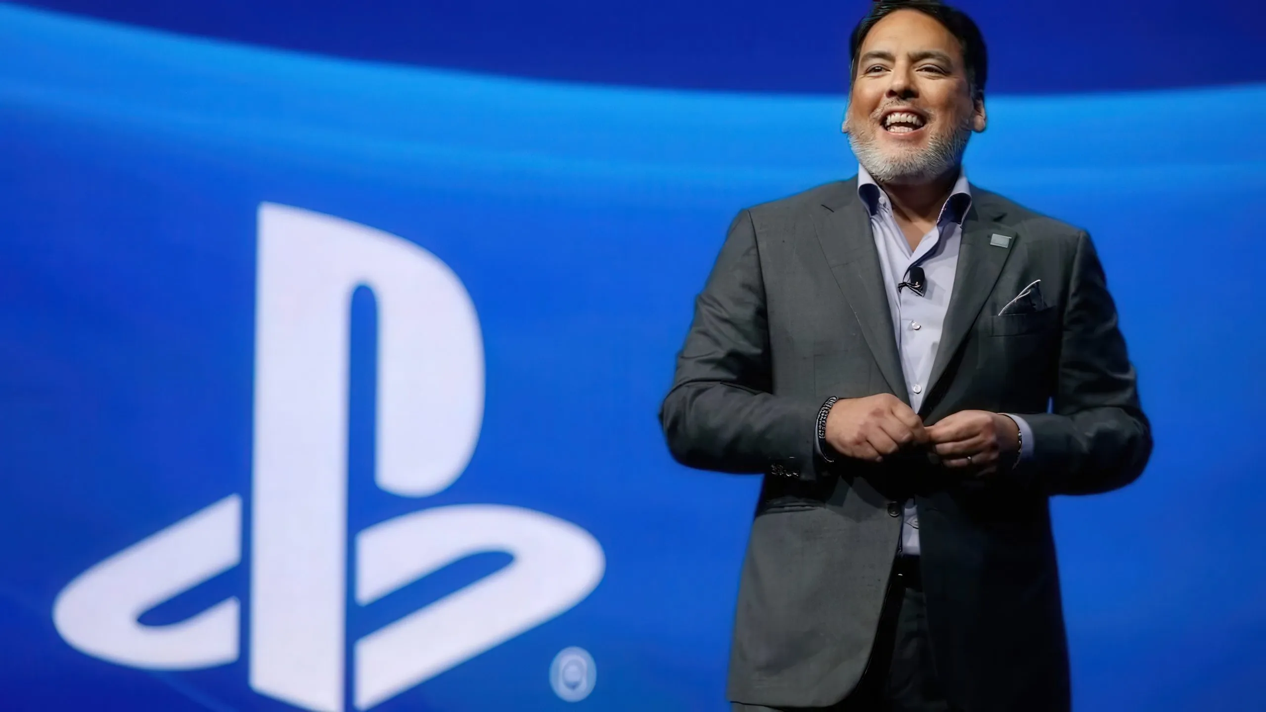 Shawn Layden, former PlayStation boss, next to the brand’s logo