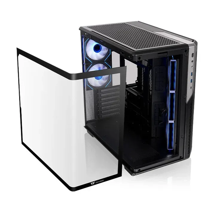 The curved panel removed next to the Thermaltake View 590, with the interior accessible