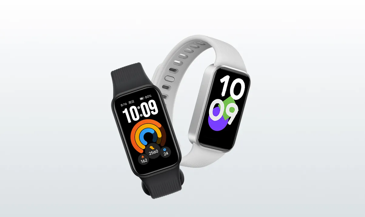 Dos REDMI Band 4 en colores oscuro y plateado con distintas esferas digitales