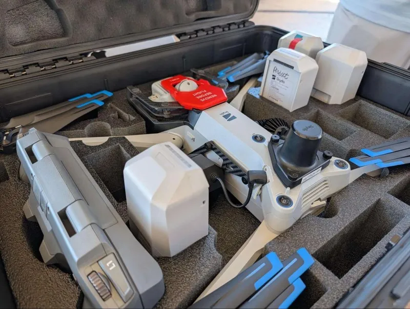 Skydio X10 drone stored in its case with the controller, the RTK module and spare batteries